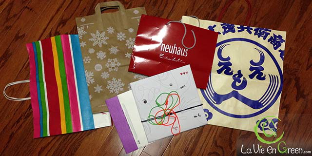 Reusing retailers' pretty Christmas & holiday season's gift bags for sustainable ecofriendly green gift wrapping